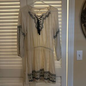 Peasant dress with flowy sleeves and skirt. Will look cute with a belt